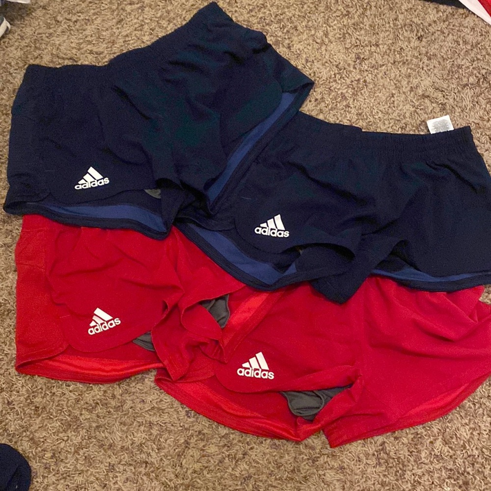 4 pack of adidas shorts. 2 blue and 2 red.